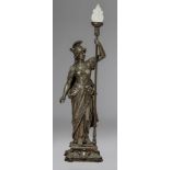A patinated spelter sculpture of Athena standing and holding a torch, H 120 cm
