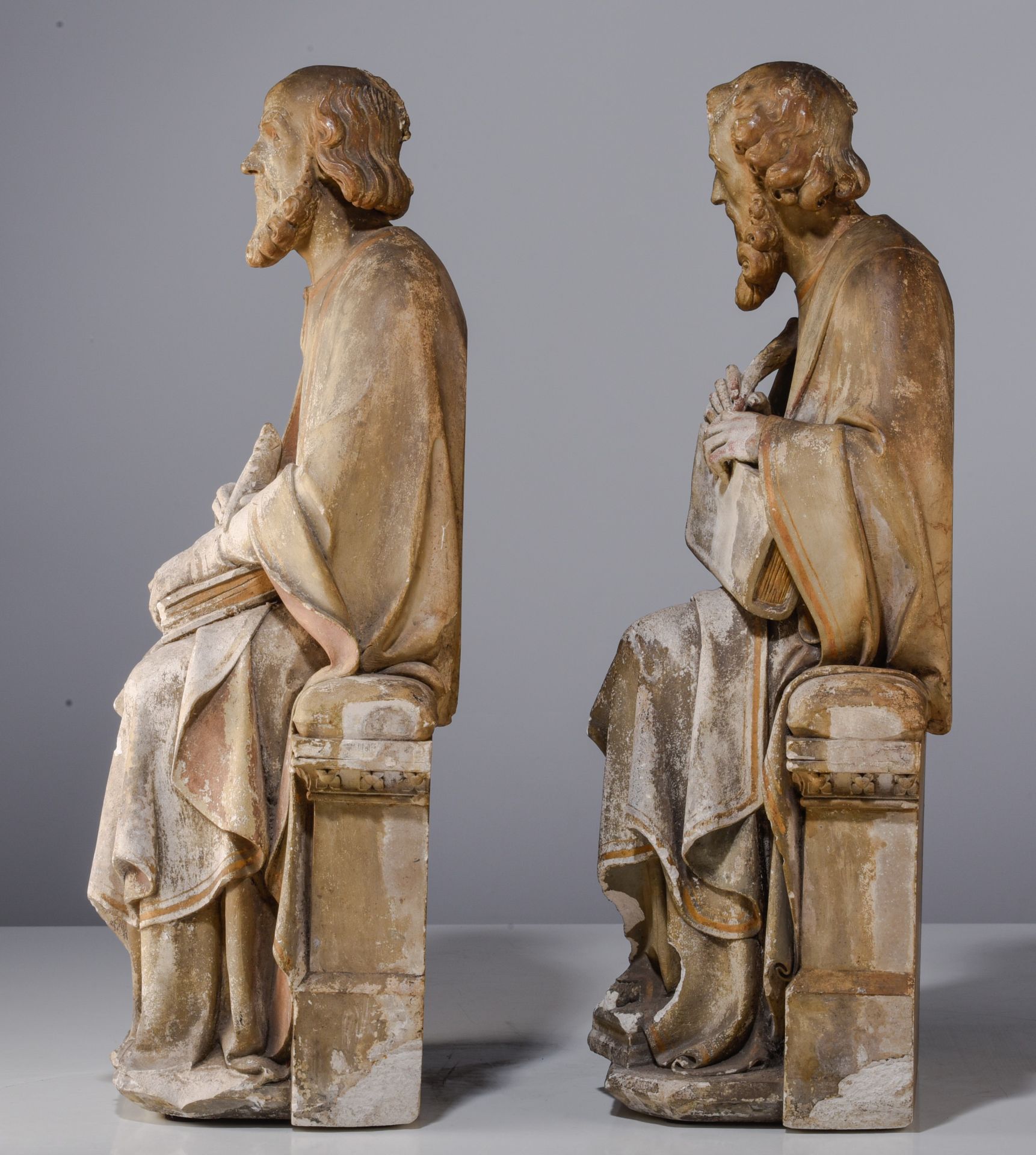 A pair of patinated reconstituted stone sculptures of seated Evangelist, in the style of the 15thC, - Image 3 of 12