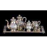 A Vietnamese silver coffee and tea set, on a mirror tray, 900/000, H 10,5 - 19 cm - 36 - 56 cm (the