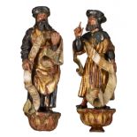 A fine pair of polychrome painted walnut sculptures of saints, 16th/17thC, the Southern Netherlands,