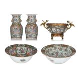 A collection of Chinese Canton famille rose basins, punch bowl and vases, 19thC, tallest H 36 cm