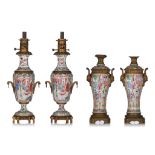 A collection of Chinese Canton famille rose lampstands, with gilt metal mounts, 19thC, Total H 60 cm