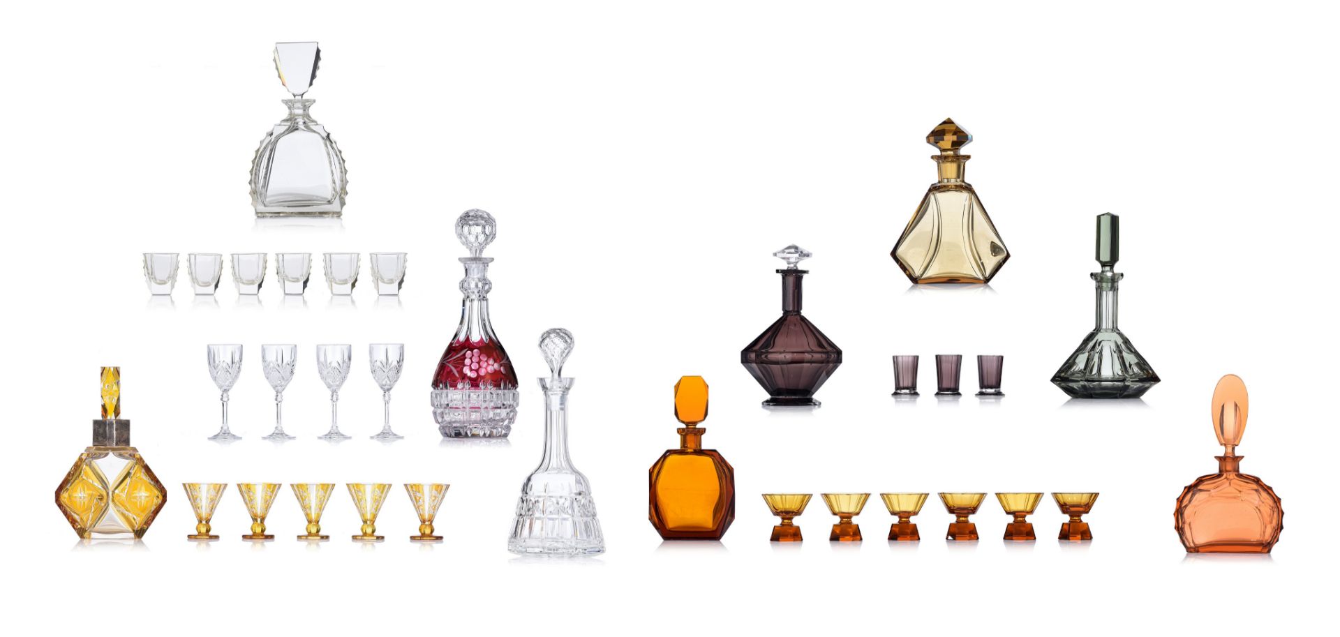 (BIDDING ONLY ON CARLOBONTE.BE) A large collection of various decanters with matching liquor glasses