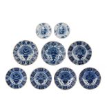 A collection of nine blue and white Dutch Delft dishes and chargers, 18thC, dia 23 - 36 cm