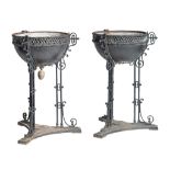 A pair of Neoclassical painted wrought iron plant stands, H 95 - dia 54 cm