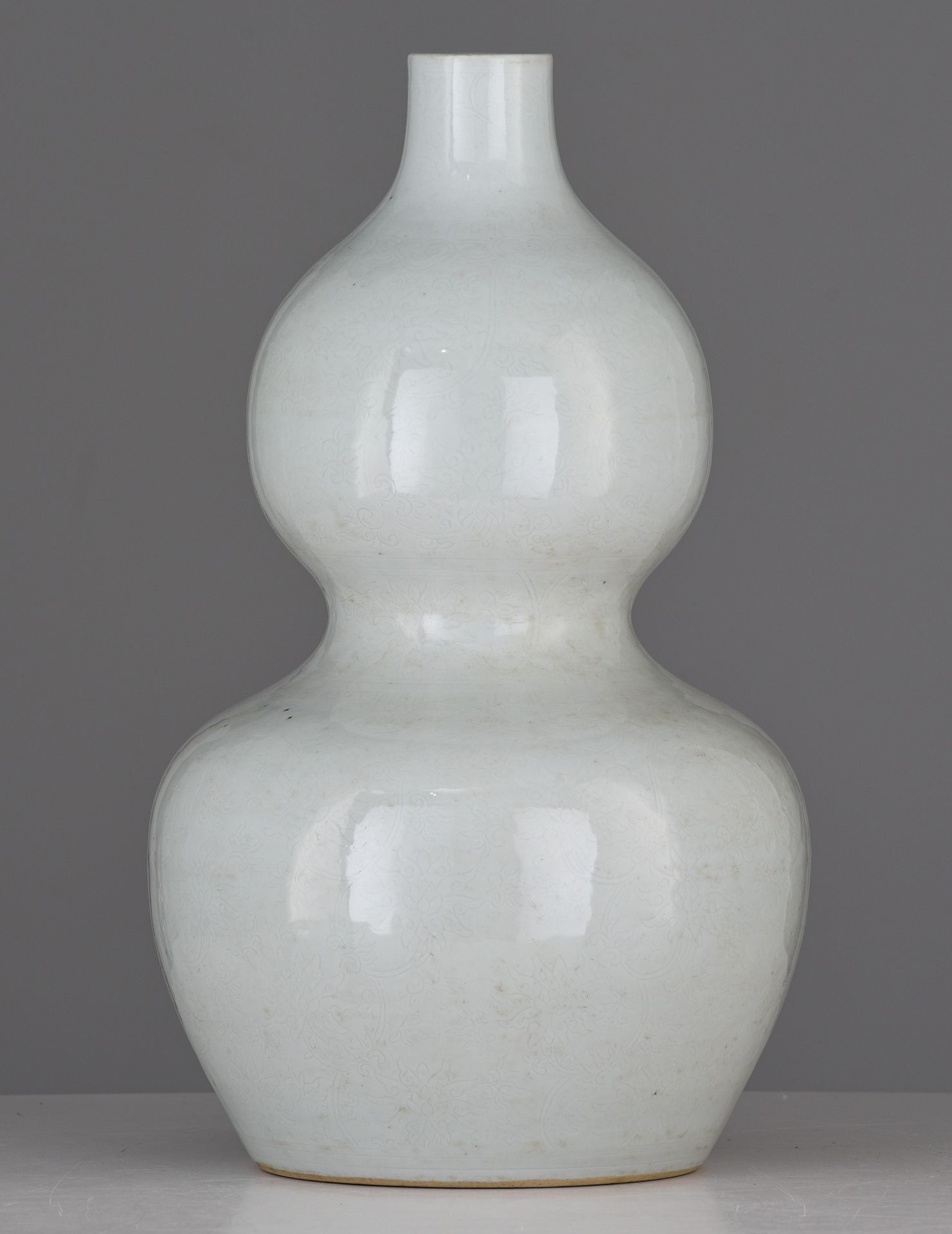 A Chinese anhua tianbai-glazed double-gourd vase, incised with 'Da Ming Wanli Nian Zhi' at the botto - Image 3 of 7