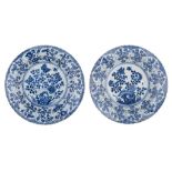 A similar pair of fine Chinese blue and white floral decorated chargers, Kangxi symbol mark and of t