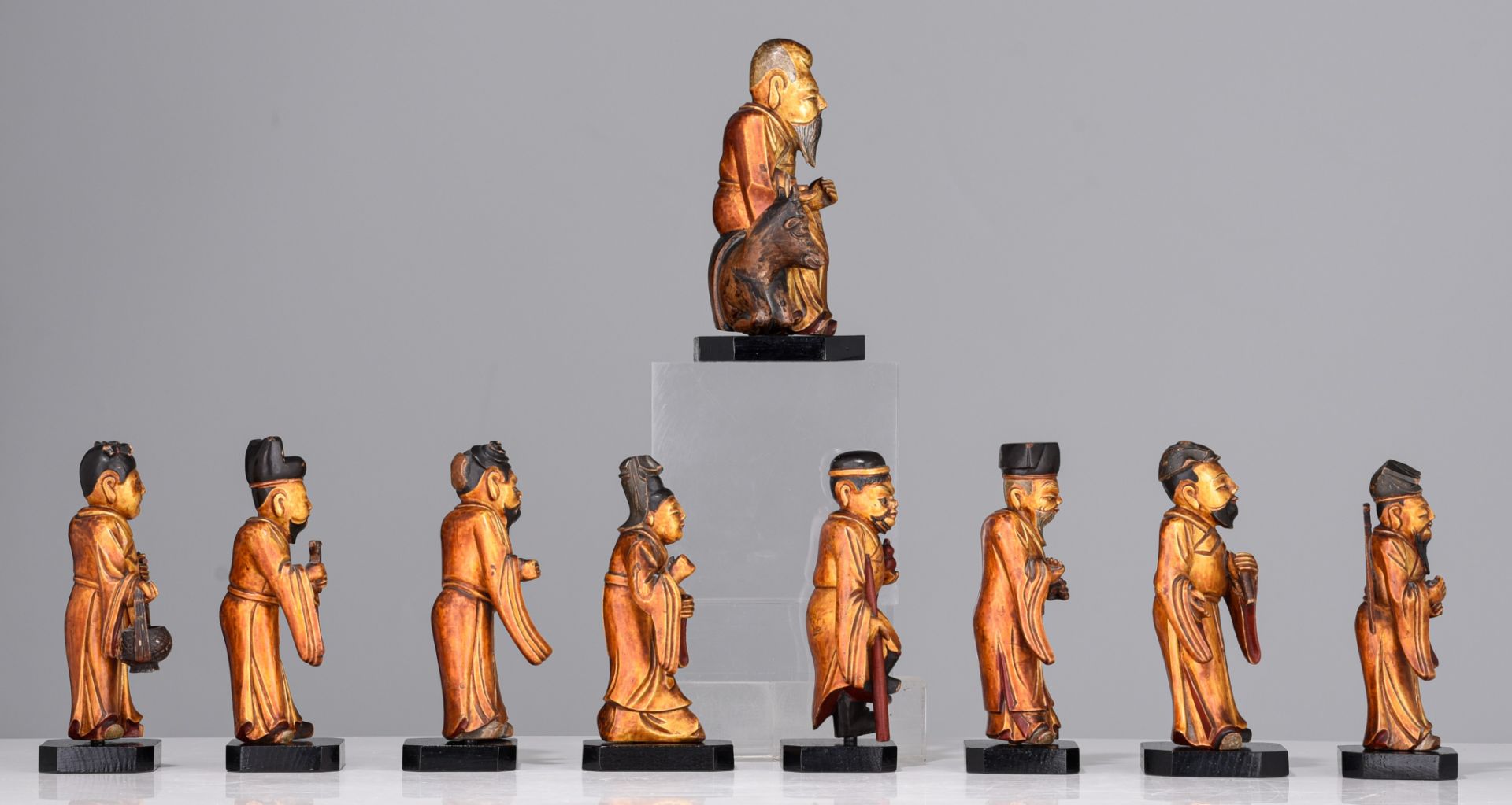 A set of nine Chinese gilt lacquered figures of the Eight Immortals and Shou Lou, 19thC, tallest H 1 - Image 5 of 9