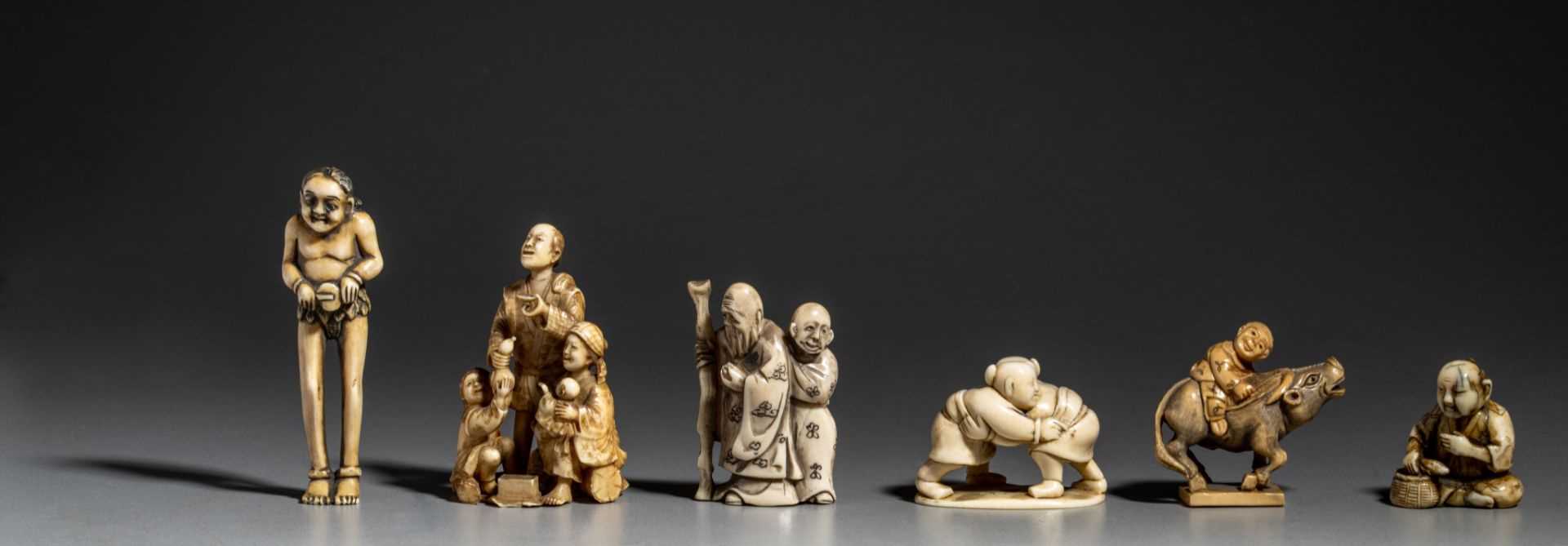 A collection of six ivory Japanese figurines, one okimono and five netsukes (+) - Image 2 of 8