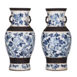 A similar pair of blue and white on crackle-glazed vases, paired with prunus handles, 19thC, H 44,5