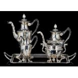 A four-part Empire-style silver coffee and tea set on a matching plate, 800/000, ca 5947 g