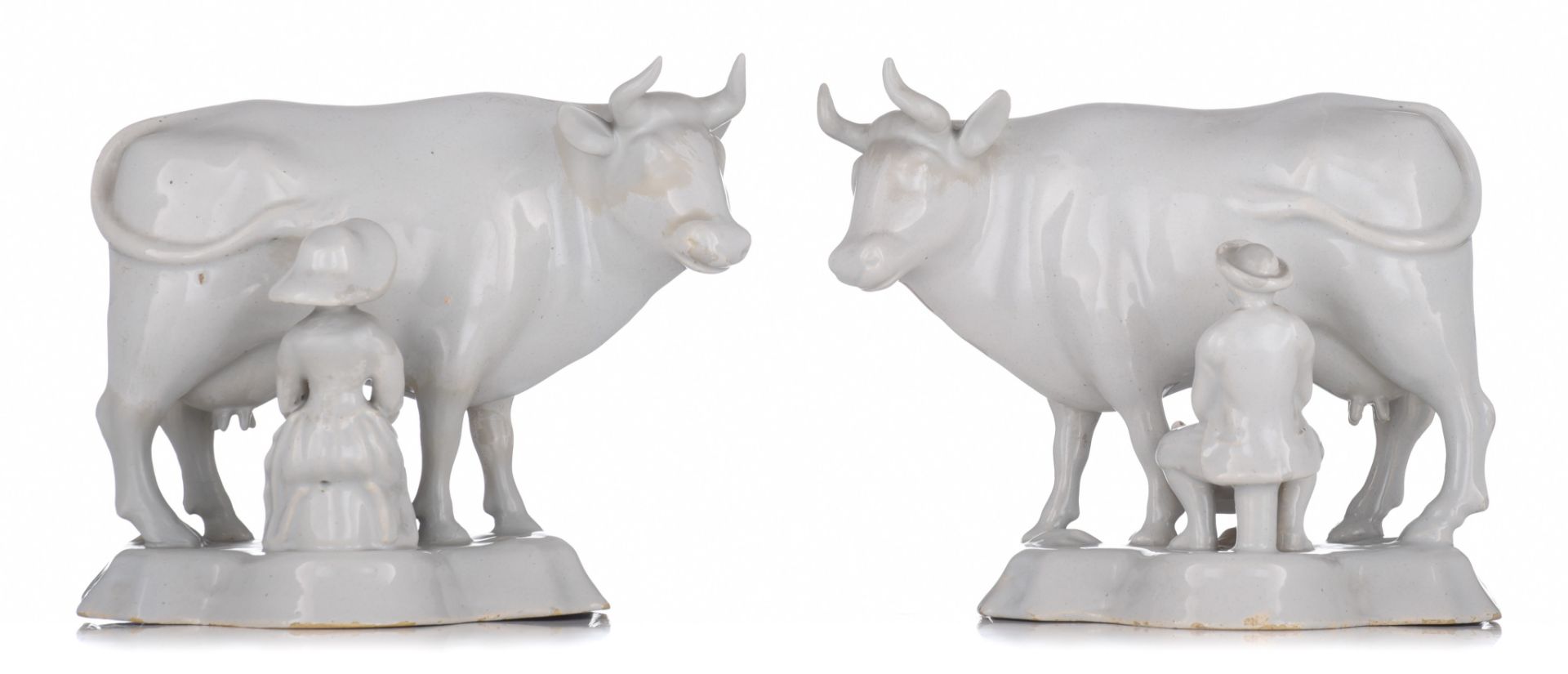 A large pair of Delft white-glazed models of cows with milkers, 18thC, H 18 - W 22 cm - Image 5 of 14