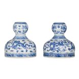 A pair of Chinese blue and white garlic-mouth 'Dragon' bottle vases, with a Daoguang mark, H 19 cm