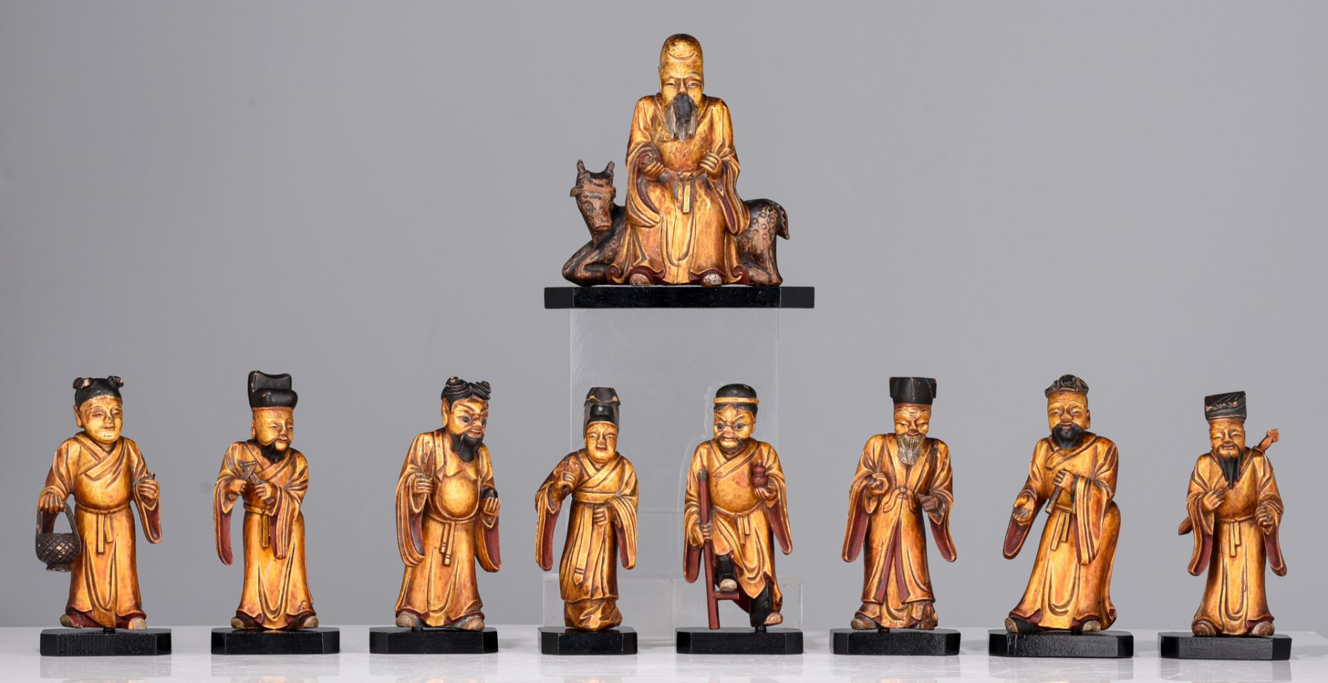 A set of nine Chinese gilt lacquered figures of the Eight Immortals and Shou Lou, 19thC, tallest H 1 - Image 2 of 9