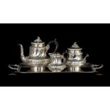 A Rococo Revival three-part silver coffee set with a matching tray, total weight: ca 3848 g