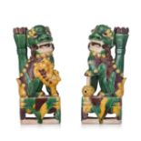 A pair of Chinese sancai-glazed 'Buddhist Lion' joss stick holders, Kangxi period, H 20,3 cm