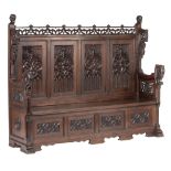 An impressive Gothic Revival richly carved walnut hall bench, H 156 - W 191 - D 58 cm