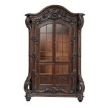 A large and abundantly decorated oak Rococo style display cabinet, H 212 - W 130 - D 58 cm