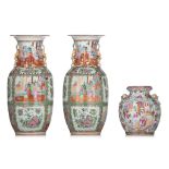 A similar pair of Chinese Canton famille rose vases, 19thC, H 44,5 cm - added a Chinese Canton pomeg