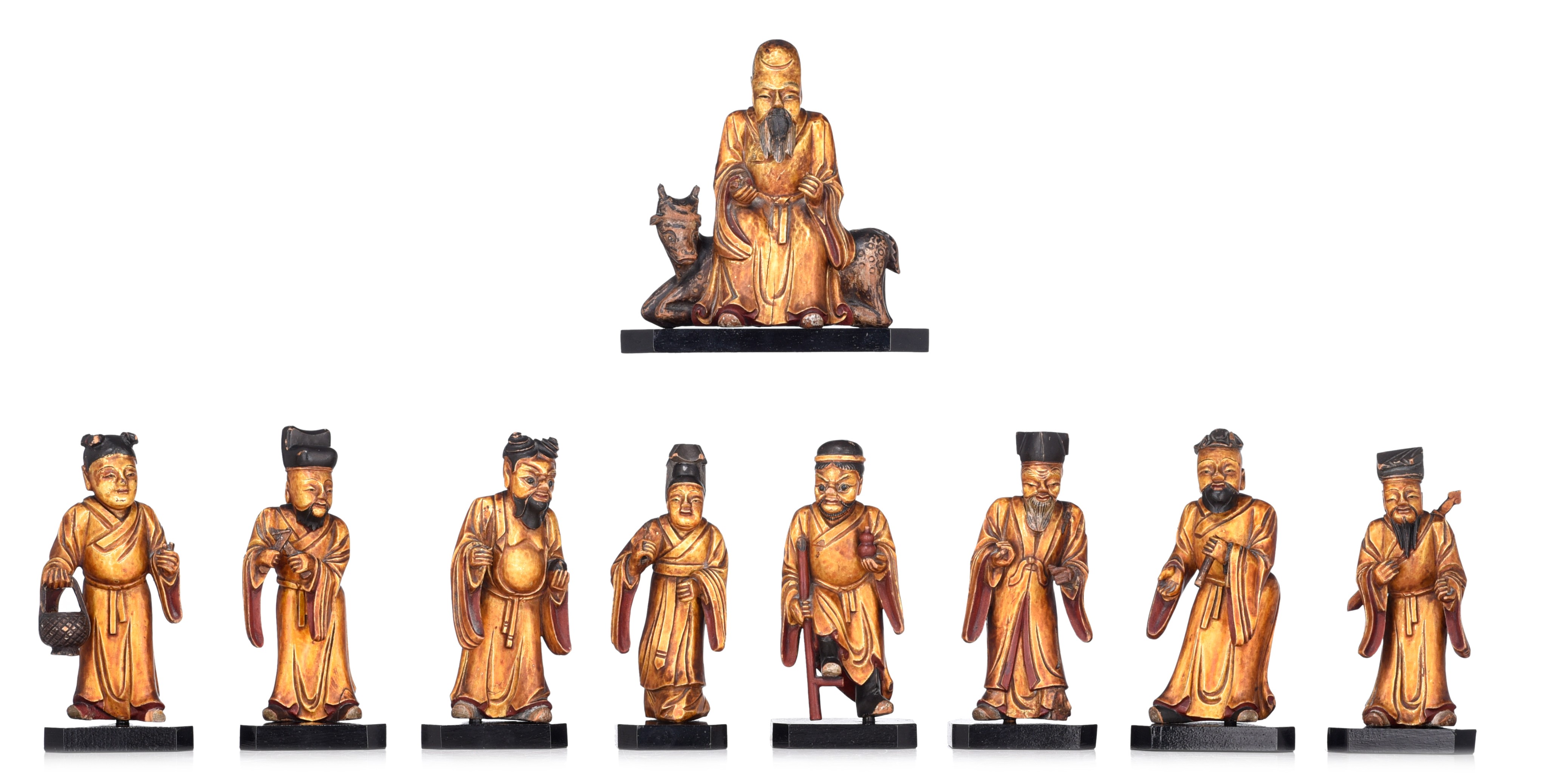 A set of nine Chinese gilt lacquered figures of the Eight Immortals and Shou Lou, 19thC, tallest H 1