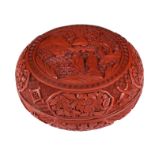 A Chinese carved cinnabar lacquered round box and cover, late Qing, dia. 19,5 - H 9,5 cm
