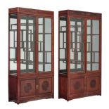 Two Chinese hardwood display cabinets, the doors with glass, 198 x 101,5 x 35,5 cm