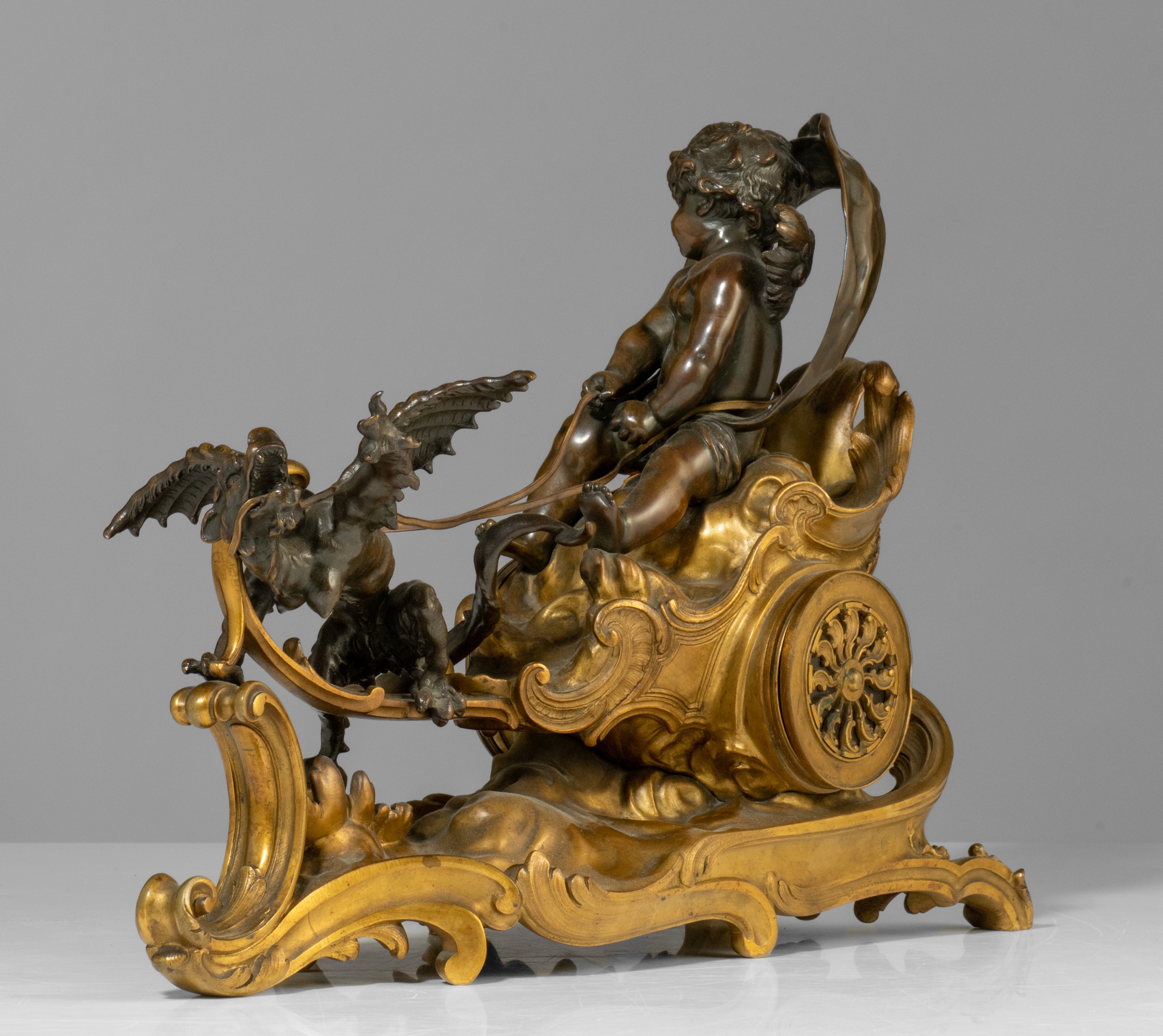 A Rococo style mantle clock with Cupid on his chariot and a pair of matching candlesticks, H 19,5 - - Image 4 of 9