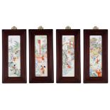 A series of four Chinese famille rose porcelain plaques, fitted in a hardwood frame, each with a sig