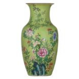 A Chinese famille rose on sgraffito lime green ground vase, late 19thC/20thC, H 37,5 cm