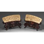Two Chinese ivory carved plaques with matching scenes, one high-relief carved with a battle scene, t