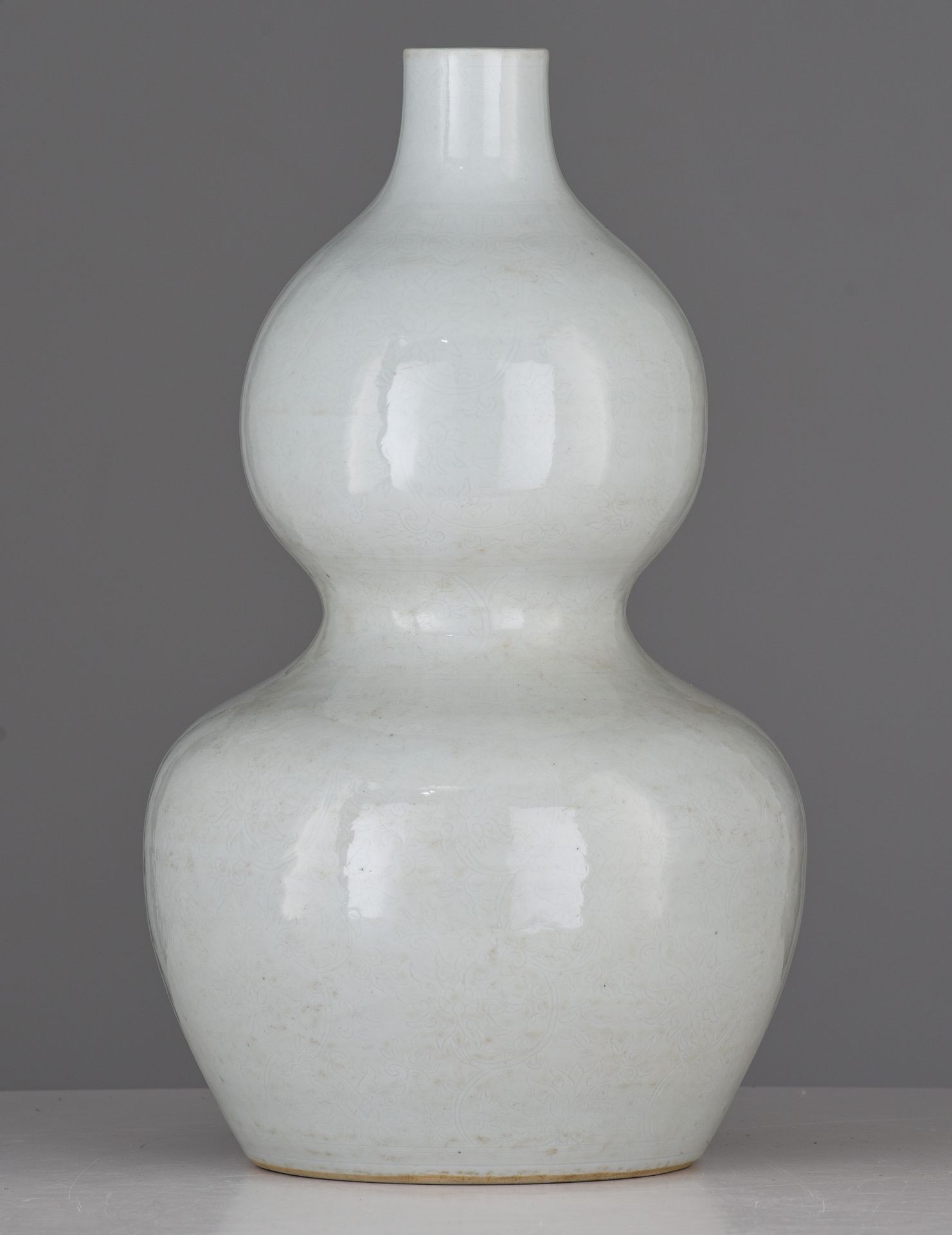 A Chinese anhua tianbai-glazed double-gourd vase, incised with 'Da Ming Wanli Nian Zhi' at the botto - Image 4 of 7