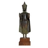 A Thai bronze figure of the standing Buddha Shakyamuni, presumably Ayutthaya, 16thC/17thC, H 37 cm