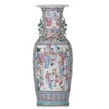 A Chinese famille rose vase, paired with Fu lion handles, 19thC, H 61,5 cm
