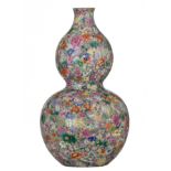 A Chinese famille rose Mille-Fleurs double-gourd vase, with a Qianlong mark, H 33,5 cm