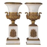 A pair of Neoclassical Carrara marble Medici vases with gilt bronze mounts, H 44 cm