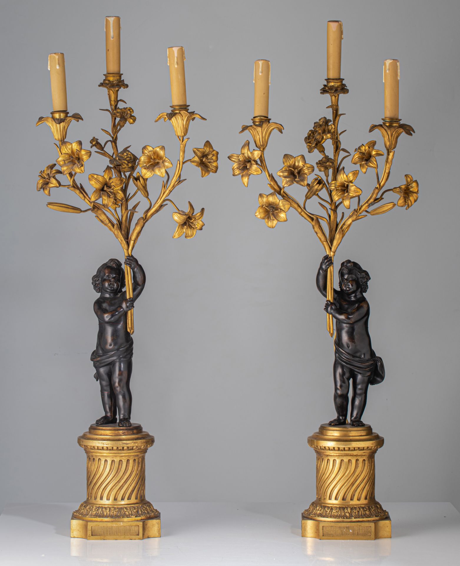 A pair of Neoclassical patinated and gilt bronze figural candelabras, H 80 cm - Image 2 of 7