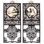 Two Chinese open-work carved hardwood hanging panels, each including an octagonal marble dream stone