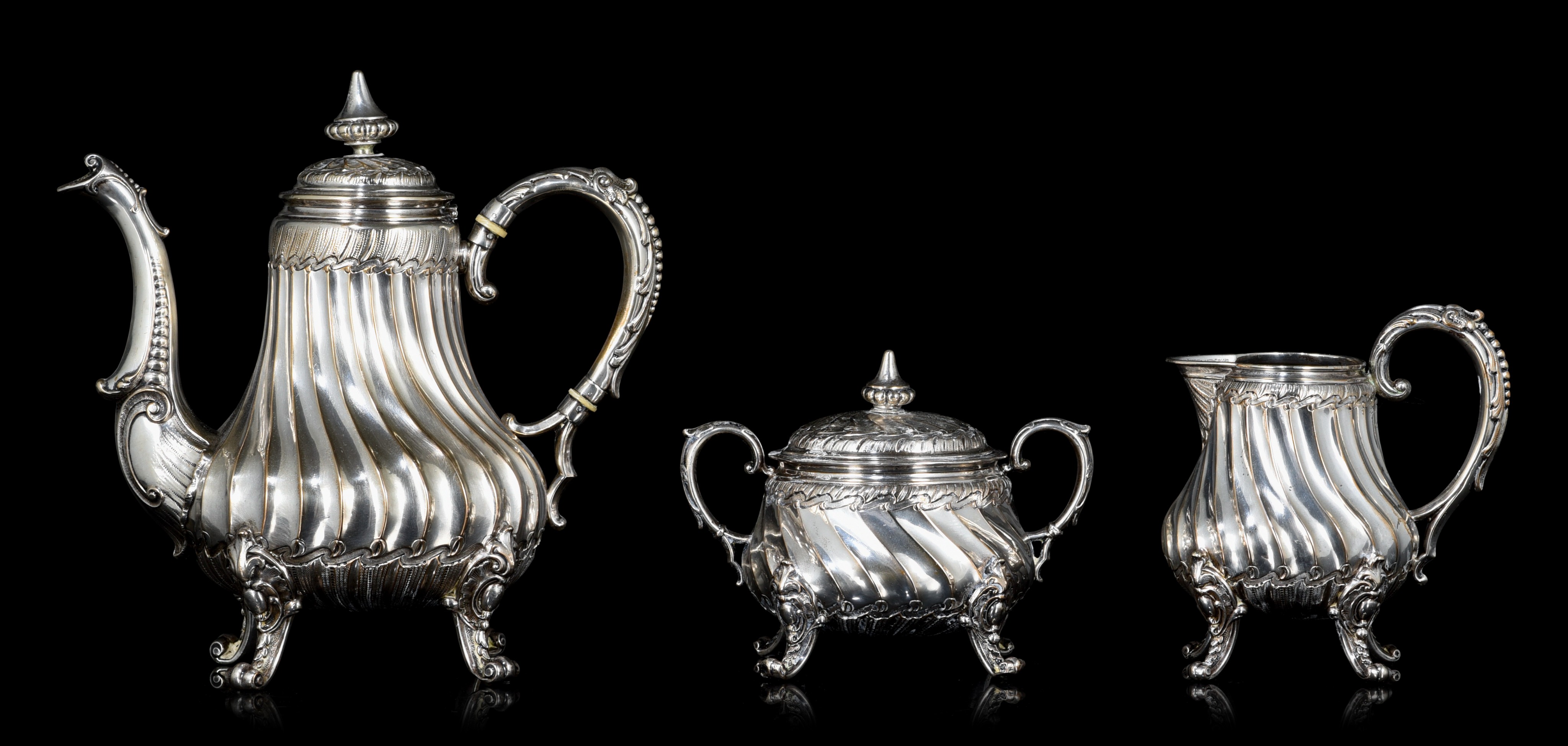 An eclectic three-part silver coffee set, Austria-Hungarian import hallmark (1872-1901)