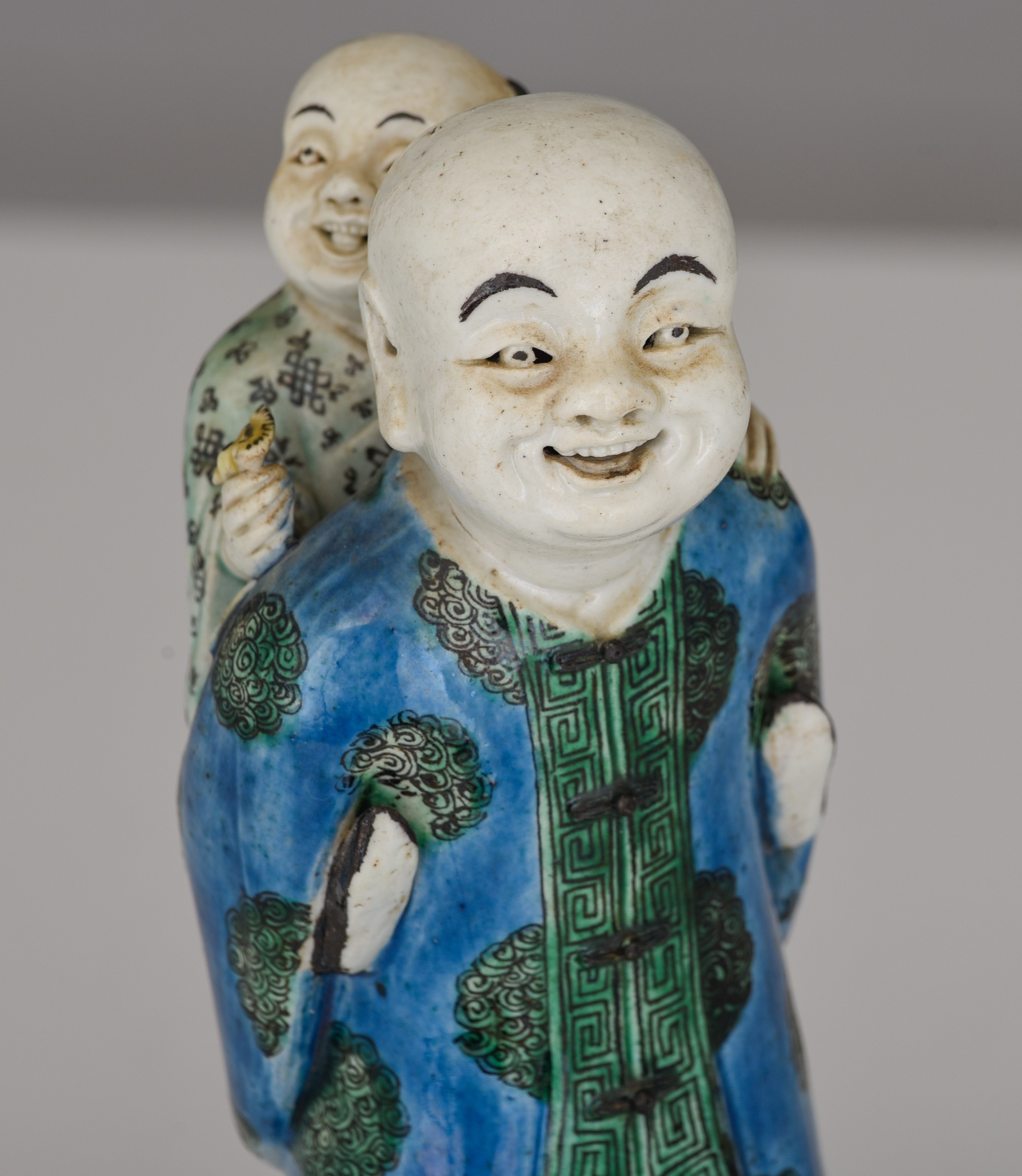 A Chinese famille verte biscuit figure of a man and boy, Republic period, H 22 cm - Image 9 of 10