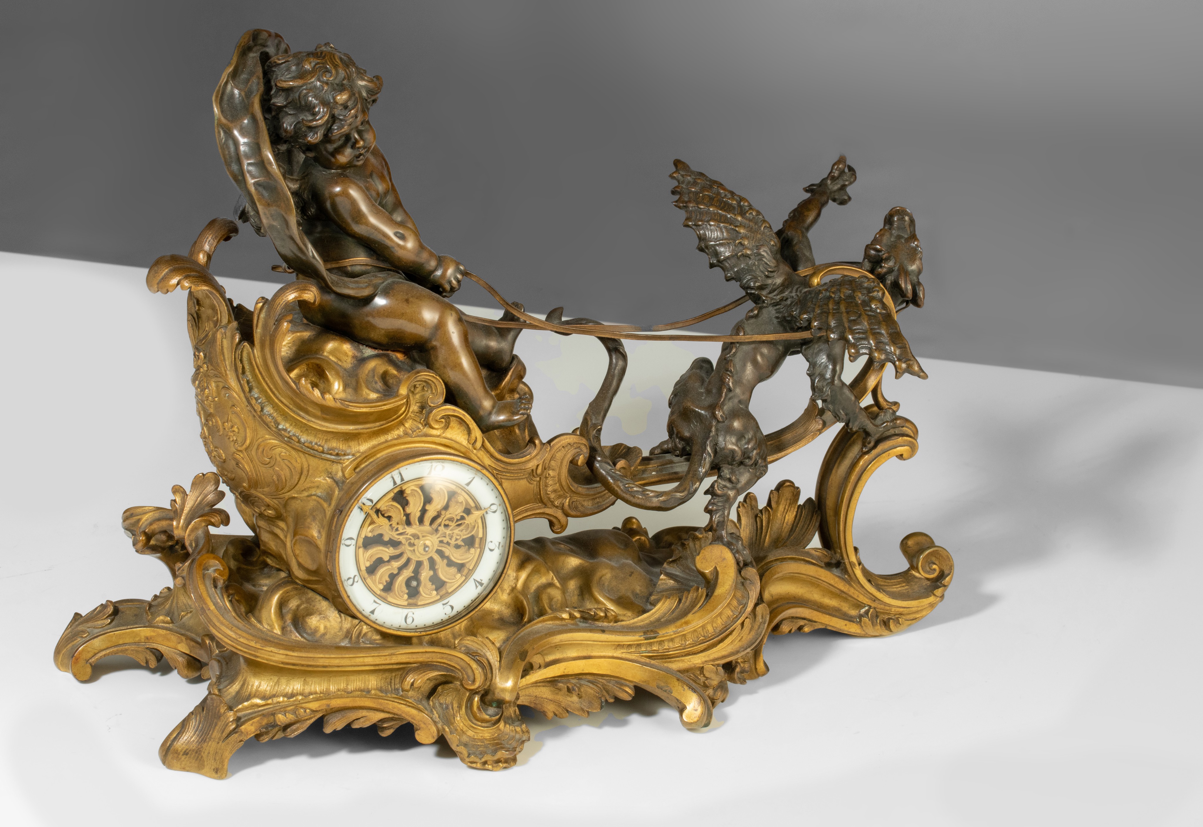 A Rococo style mantle clock with Cupid on his chariot and a pair of matching candlesticks, H 19,5 - - Image 6 of 9