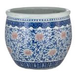 A Chinese underglaze blue and copper red 'Scrolling lotus' jardiniere, 18thC, dia. 48,5 - H 41,5 cm