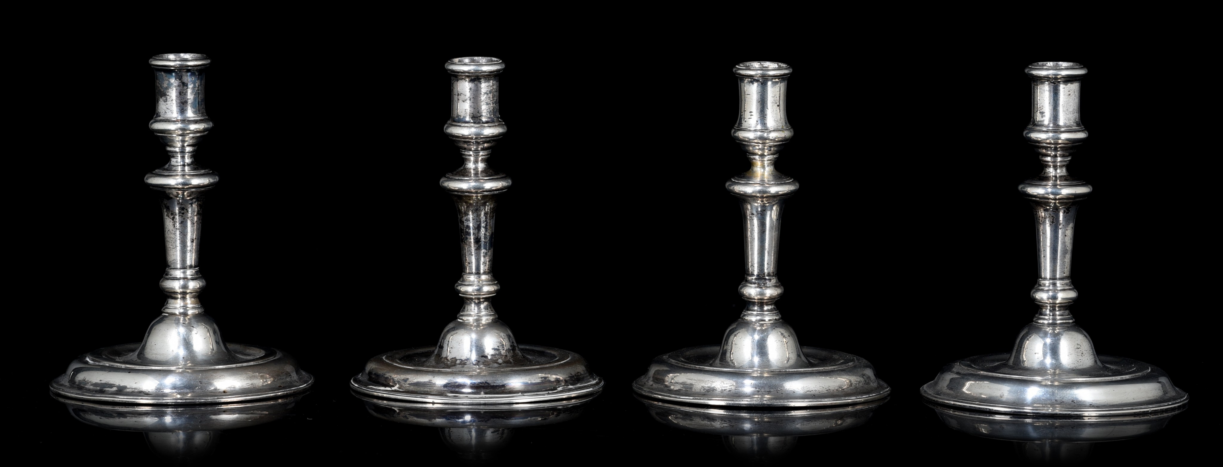 A set of four German silver candlesticks, hallmarked Dresden, mid 18thC, H 15,5 cm - total weight: 1