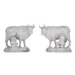 A large pair of Delft white-glazed models of cows with milkers, 18thC, H 18 - W 22 cm