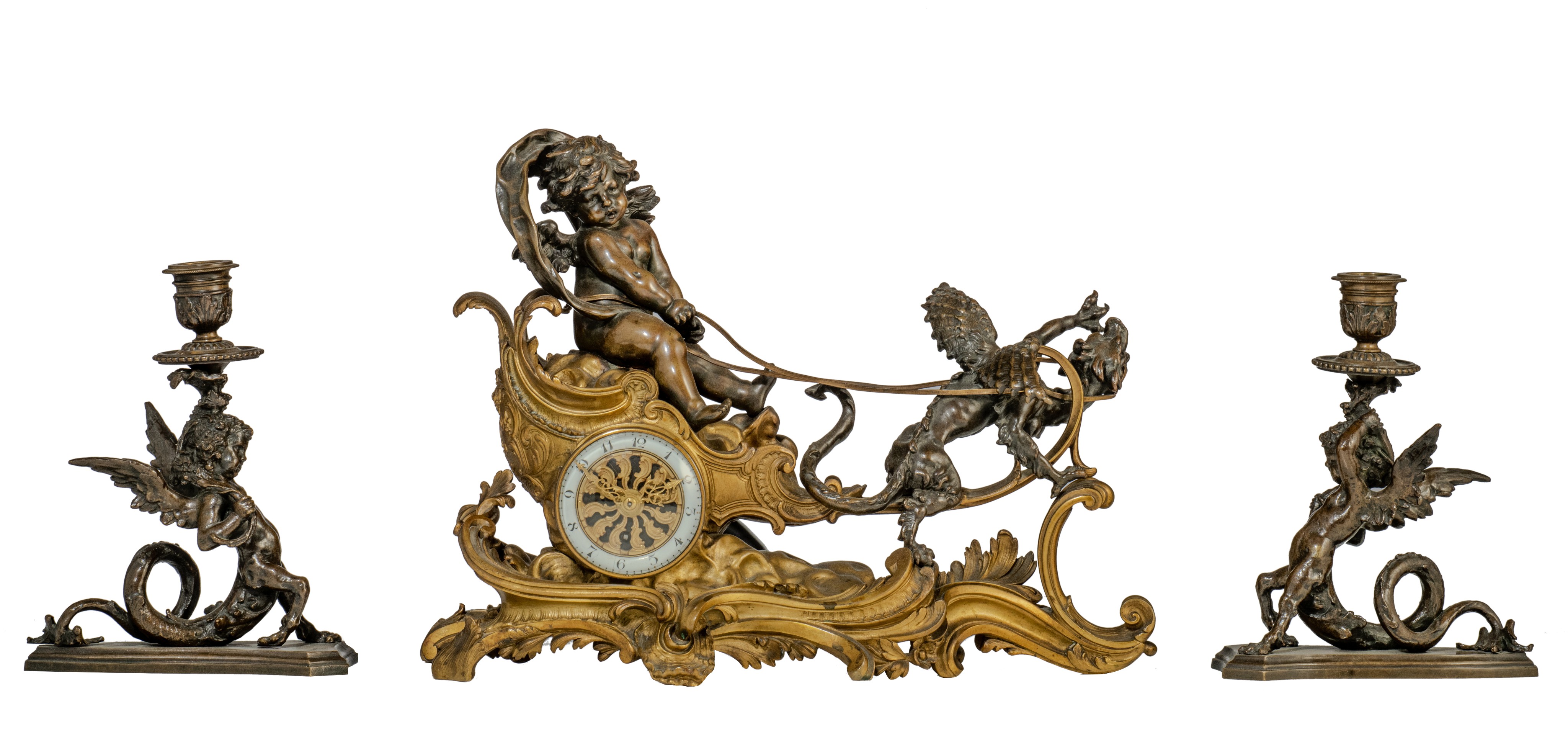 A Rococo style mantle clock with Cupid on his chariot and a pair of matching candlesticks, H 19,5 -