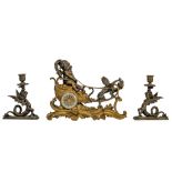 A Rococo style mantle clock with Cupid on his chariot and a pair of matching candlesticks, H 19,5 -