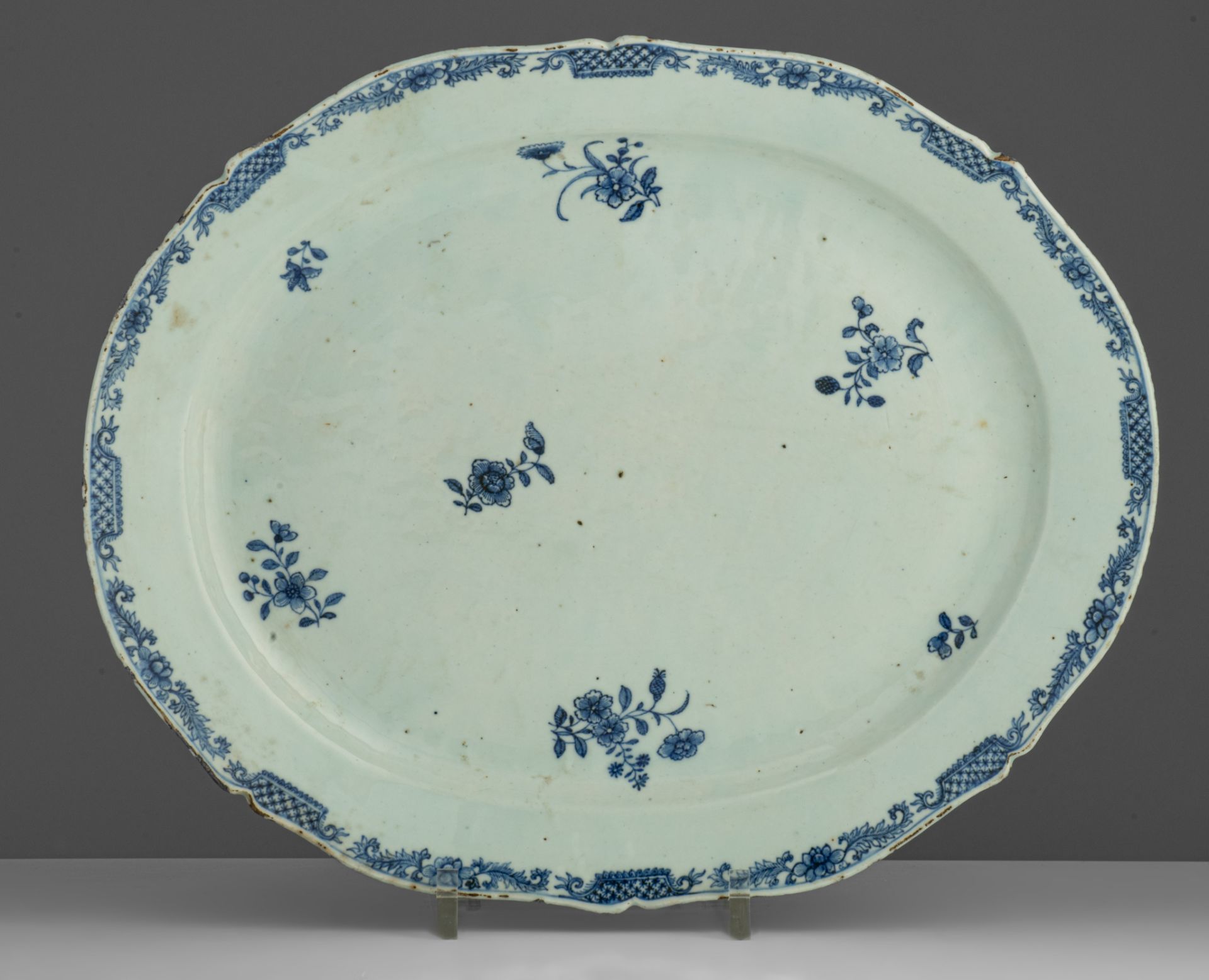 A series of four large Chinese blue and white floral decorated serving plates, 18thC, dia. 33 x 38,5 - Image 2 of 9