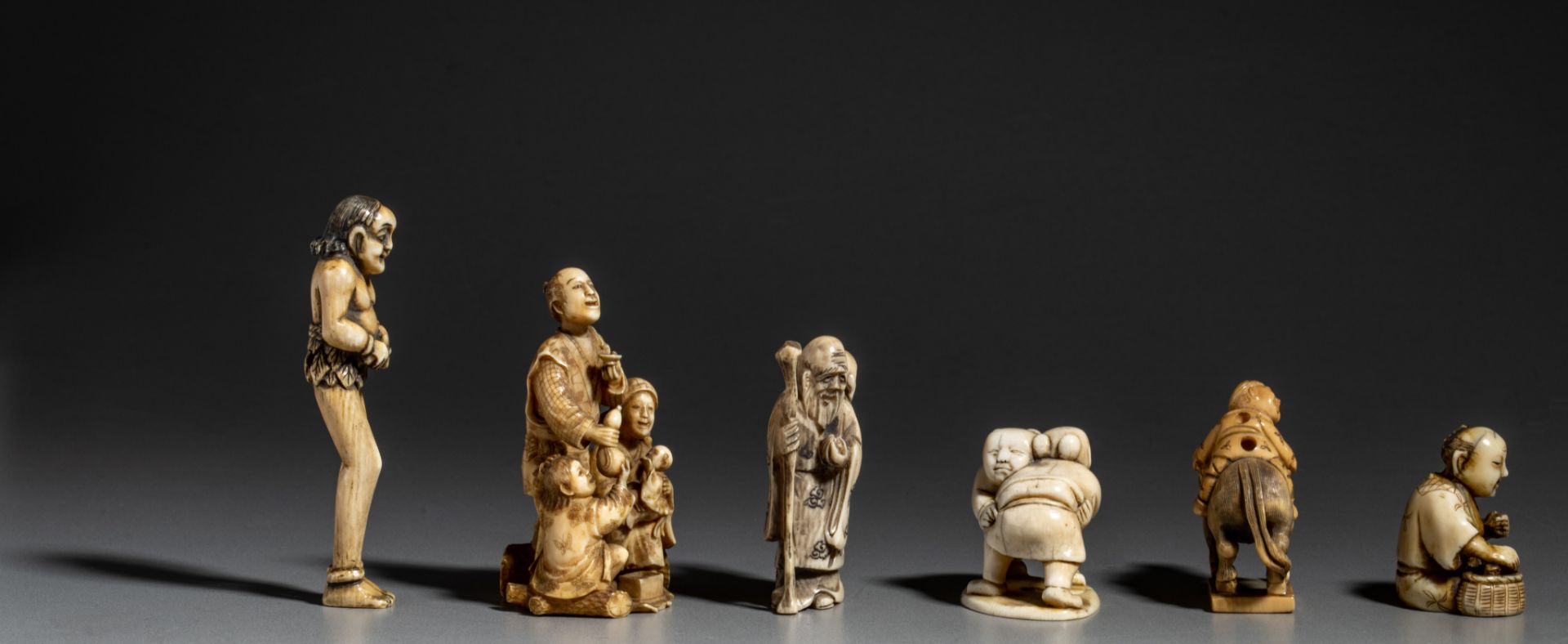 A collection of six ivory Japanese figurines, one okimono and five netsukes (+) - Image 5 of 8