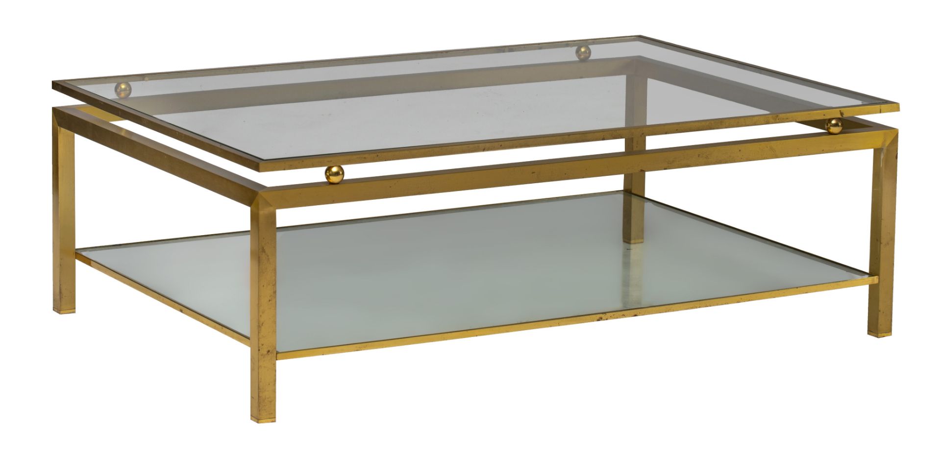 A vintage polished brass and glass coffee table by Maison Jansen, H 40 - W 120 - D 80 cm