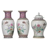 A pair of Chinese famille rose vases and a covered baluster vase, 20thC, H cm