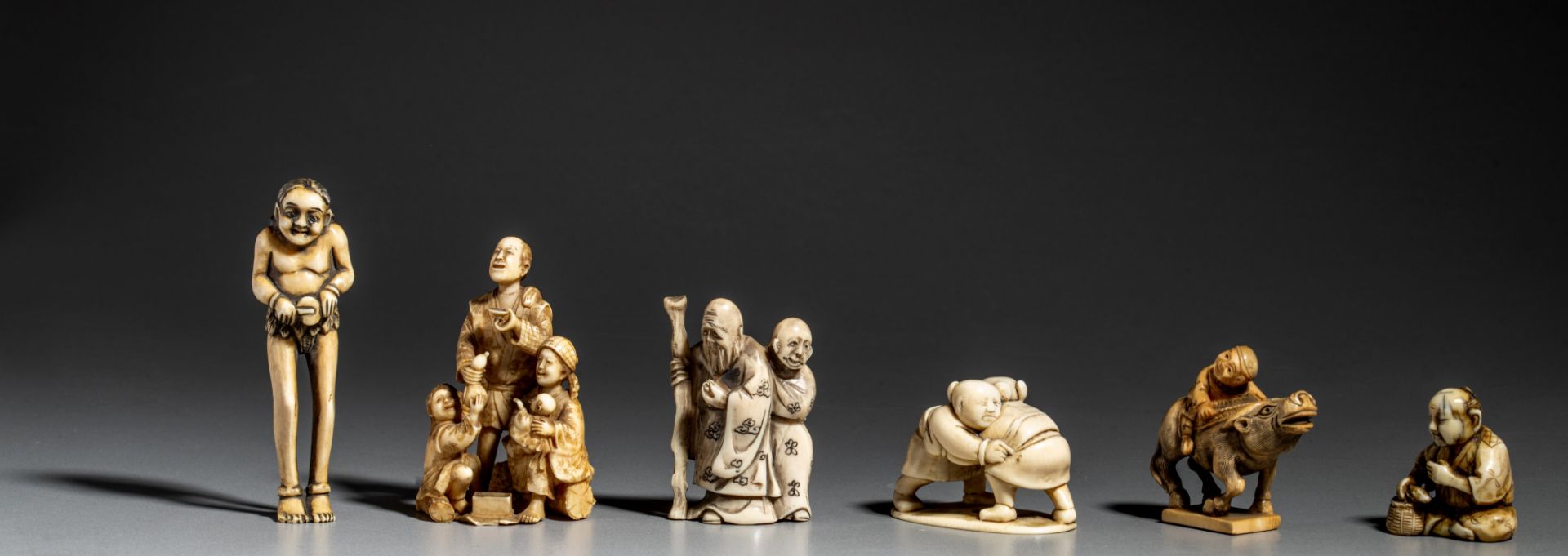 A collection of six ivory Japanese figurines, one okimono and five netsukes (+)